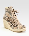 Classic ankle-grazing silhouette modernized by a snake-print faux leather upper, lace-up front and an espadrille wedge. Braided hemp wedge, 4 (100mm)Braided hemp platform, 1 (25mm)Compares to a 3 heel (75mm)Snake-print faux leather and burlap upperRubber solePadded insoleMade in SpainOUR FIT MODEL RECOMMENDS ordering true whole size; ½ sizes should order the next whole size up. 