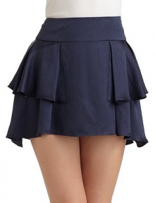 Wrap-around ruffles in shimmering silk, with a hem that dips slightly lower in back.Wide set-on waistband Ruffled detail Back hook and zipper closure About 15½ long Silk; dry clean Imported Wrap-around ruffles in shimmering silk, with a hem that dips slightly lower in back.Wide set-on waistband Ruffled detail Back hook and zipper closure About 15½ long Silk; dry clean Imported