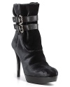 Luxe leather buckles wrap these stiletto velvet booties in structured style. By Stuart Weitzman.