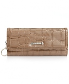 Sass with class, this croc-embossed pattern clutch from Nine West is the perfect balance of edge and elegance. Faux patent leather lends sleek shine along with custom silver-tone hardware, while the well-organized interior is aligned with card slots, bill compartments and extra pockets for other essentials. Sass with class, this croc-embossed pattern clutch from Nine West is the perfect balance of edge and elegance. Faux patent leather lends sleek shine along with custom silver-tone hardware, while the well-organized interior is aligned with card slots, bill compartments and extra pockets for other essentials.