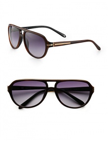 A modern design accented with logo detail at the temples, complements a classic aviator frame crafted from lightweight resin. Available in brown frames with gradient blue lenses.Metal100% UV ProtectionMade in Italy A modern design accented with logo detail at the temples, complements a classic aviator frame crafted from lightweight resin. Available in brown frames with gradient blue lenses.Metal100% UV ProtectionMade in Italy