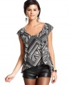 Love the swingy silhouette and tulip-back design of this top from Material Girl! For a look that's rocker-cool, pair the top with faux-leather shorts!