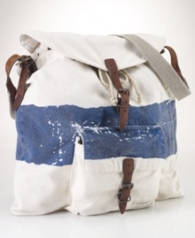 Steeped in nautical inspiration, a canvas bag is accented with rope details and distressed painted stripes. Steeped in nautical inspiration, a canvas bag is accented with rope details and distressed painted stripes.