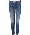 The ultimate must-have, these luxe jeans from It denim brand Mother are the favorite skinnies of the fashion flock - Classic five-pocket styling, stylishly faded denim, ankle length, skinny leg - Style with an oversized cashmere pullover, a wool cape, and platform booties