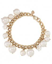 Lovely and lustrous. A combination of glass and plastic pearls adorn this fashionable flex bracelet from Carolee. Crafted in antique gold tone mixed metal, it's sure to stand out as an elegant enhancement each time you wear it. Approximate length: 7-1/2 inches.