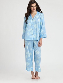 Romantic flowers decorate this classic pajama set in ultra-soft cotton sateen. Notch collarDropped shouldersLong sleevesButton frontContrast piping at neckline and cuffsElasticized waistbandInseam, about 26CottonMachine washImported Romantic flowers decorate this classic pajama set in ultra-soft cotton sateen. Notch collarDropped shouldersLong sleevesButton frontContrast piping at neckline and cuffsElasticized waistbandInseam, about 26CottonMachine washImported