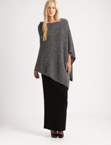 A hint of sparkle and asymmetrical hem add a modern touch to the classic poncho.BoatneckAsymmetrical hemPull-on styleAbout 24 from shoulder to hemMohair/nylon/wool/polyester/acrylic/alpacaDry cleanImported of Italian fabric