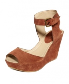 Characterized by its smooth suede and ultra-femme wrapped wedge, this strappy ankle platform sandal from Kenneth Cole Reaction is sure to infuse any warm-weather ensemble with fierce flair. Characterized by its smooth suede and ultra-femme wrapped wedge, this strappy ankle platform sandal from Kenneth Cole Reaction is sure to infuse any warm-weather ensemble with fierce flair.