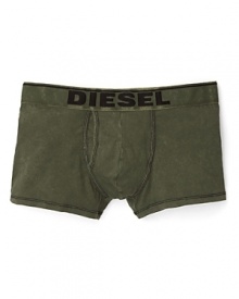These classic cut Diesel boxer trunks in fatigue green feature a bold logo waistband. These classic cut Diesel boxer trunks in fatigue green feature a bold logo waistband.