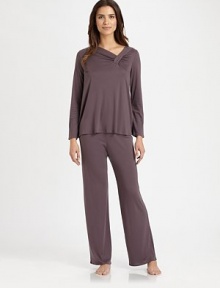 Soft-stretch cotton silhouette with an asymmetrical neckline and ruched details for a contemporary look. Asymmetrical ruched necklineLong sleevesElasticized waistband50% cotton/50% micromodalMachine washImported Soft-stretch cotton silhouette with an asymmetrical neckline and ruched details for a contemporary look. Asymmetrical ruched necklineLong sleevesElasticized waistband50% cotton/50% micromodalMachine washImported