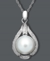 The perfect finishing touch. This elegant pendant features a chic, teardrop shape highlighting a cultured freshwater pearl (9-10 mm) and sparkling diamond accents. Set in sterling silver. Approximate length: 18 inches. Approximate drop: 1 inch.