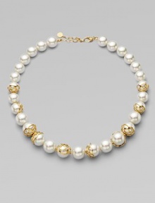 An exquisite strand of graduated pearls accented with 18k gold flower cup caps.14mm & 16mm round white organic man-made pearls18k goldplated sterling silverLength, about 16 to 18 adjustableLobster clasp closureImported 