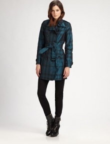 A chic tonal plaid patterns this classic trench design.Foldover collarGunflapDouble-breasted button frontSelf beltButton pocketsBelted cuffsButton rainflapAbout 30 from shoulder to hemPolyesterDry cleanImportedModel shown is 5'10 (177cm) wearing US size 4. A chic tonal plaid patterns this classic trench design.Foldover collarGunflapDouble-breasted button frontSelf beltButton pocketsBelted cuffsButton rainflapAbout 30 from shoulder to hemPolyesterDry cleanImportedModel shown is 5'10 (177cm) wearing US size 4.