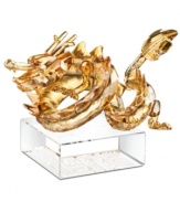 Honor the most important sign of the zodiac in exquisite Swarovski crystal. The all-powerful dragon glistens in meticulously crafted gold crystal with piercing red eyes. A symbolic gift for family and friends, on a base engraved with both English and Chinese seal script.