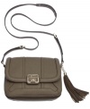 Practical and perfectly sized for anything the day delivers, this essential crossbody from GUESS goes from work to weekend without a worry. Outfitted with separate interior compartments, pockets aplenty and eye-catching exterior accents, it's no wonder girls on-the-go opt for this accessory.