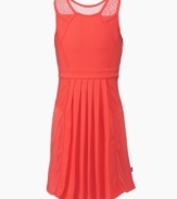Hot style with a cool design, sheer mesh overlays on the shoulders of this DKNY dress add a unique twist.