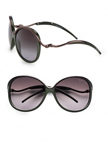 Feminine style with metal accented temples, top rim and bridge on a lightweight, acetate frame. Available in green/brown with smoke gradient lens. Logo etched lens100% UV protectionMade in Italy Feminine style with metal accented temples, top rim and bridge on a lightweight, acetate frame. Available in green/brown with smoke gradient lens. Logo etched lens100% UV protectionMade in Italy