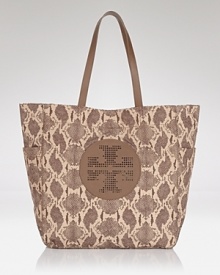 Clean lines and a strong shape makes Tory Burch's tote bag both classic and modern. Crafted from durable nylon and trimmed in leather, it's a practically perfect for running errands. Clean lines and a strong shape makes Tory Burch's tote bag both classic and modern. Crafted from durable nylon and trimmed in leather, it's a practically perfect for running errands.