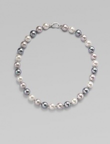 Three gentle tones - grey, nuage and white - come together in a graceful strand of round organic pearls with a sterling silver clasp. 12mm round man-made multicolor pearls Length, about 17 Sterling silver spring clip clasp Made in Spain Three gentle tones - grey, nuage and white - come together in a graceful strand of round organic pearls with a sterling silver clasp. 12mm round man-made multicolor pearls Length, about 17 Sterling silver spring clip clasp Made in Spain