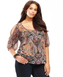 Delicate beading adds a touch of shine to INC's cutout-shoulder plus size top. The intricate paisley print gives this look a touch of exotic glamour.