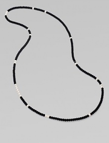 From the Night Blue Collection. This high contrast piece features a long strand of flocked velvet beads punctuated by pearlized glass beads. Length, about 49½ Slip-on style Imported From the Night Blue Collection. This high contrast piece features a long strand of flocked velvet beads punctuated by pearlized glass beads. Length, about 49½ Slip-on style Imported