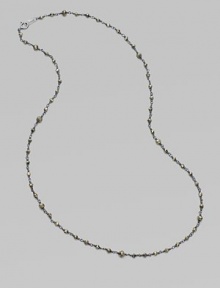 A long, elegant chain of oxidized sterling silver is richly dotted with rough pyrite beads.Pyrite Oxidized sterling silver Length, about 18 Spring ring clasp Made in USA A long, elegant chain of oxidized sterling silver is richly dotted with rough pyrite beads.Pyrite Oxidized sterling silver Length, about 18 Spring ring clasp Made in USA