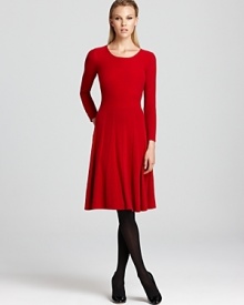 A plush Armani Collezioni cashmere dress slips on for cozy chic. Complete with a subtly pleated skirt that flares elegantly from waistline to knee, this sweater style is winter's must have.