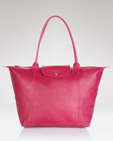 A bright alternative to black, Longchamp's fuchsia leather tote lends color-pop luxe to your purse portfolio. The smooth bag is prime to carry must-haves on the town or during weekend getaways. A bright alternative to black, Longchamp's fuchsia leather tote lends color-pop luxe to your purse portfolio. The smooth bag is prime to carry must-haves on the town or during weekend getaways.