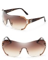 Fendi's shield logo sunglasses are futuristic and fashion-forward in sultry shades of bronze and gold.