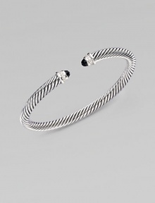 From the Color Classic Collection. A signature Yurman cable of sterling silver, richly enhanced by bands of pavé diamonds, encircling black onyx end caps. Diamonds, 0.09 tcw Black onyx Sterling silver Cable, 5mm Diameter, about 2½ Made in USA From the Color Classic Collection. A signature Yurman cable of sterling silver, richly enhanced by bands of pavé diamonds, encircling black onyx end caps. Diamonds, 0.09 tcw Black onyx Sterling silver Cable, 5mm Diameter, about 2½ Made in USA
