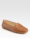 Soft leather in a timeless moccasin-inspired silhouette. Leather upper Leather lining Rubber sole Padded insole Made in ItalyOUR FIT MODEL RECOMMENDS ordering one half size up as this style runs small. 