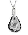 Neutral territory. Swarovski's gorgeous gray-hued crystal pendant necklace is versatile enough to complement a variety of looks in your wardrobe. Featuring a gemstone-cut satin crystal on a chain link necklace, it's set in silver tone mixed metal. Approximate length: 35-7/16 inches. Approximate drop: 2-3/8 inches.