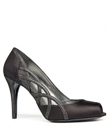 With sparkling leather accents, Stuart Weitzman's Arcade evening pumps show off side cutouts and a shimmering heel. With sparkling leather accents, Stuart Weitzman's Arcade evening pumps show off side cutouts and a shimmering heel.