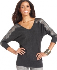 AGB gives this dolman sweater a feminine finish with sheer lace insets at the sleeves. AGB gives this dolman sweater a feminine finish with sheer lace insets at the sleeves.