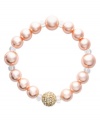 Give any ensemble a little added elegance. Charter Club's sweetly shimmering style features pink simulated pearls and a single glass fireball accent. Set in gold tone mixed metal. Bracelet stretches to fit wrist. Approximate diameter: 2-1/2 inches.