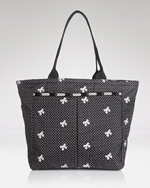 LeSportsac's signature nylon tote keeps essentials tied up with flirty white bows--let it carry you from workdays to weekends with feminine attitude. LeSportsac's signature nylon tote keeps essentials tied up with flirty white bows--let it carry you from workdays to weekends with feminine attitude.