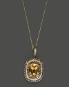 Diamonds and brown diamonds frame a faceted citrine, set in 14K white gold with rhodium details and beautiful gallery backing.