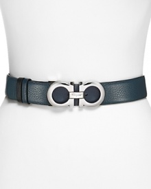 Constructed in rich leather and accented by bold hardware, this reversible belt from Salvatore Ferragamo adds polished versatility to every look. Constructed in rich leather and accented by bold hardware, this reversible belt from Salvatore Ferragamo adds polished versatility to every look.