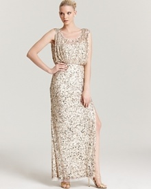 Floor-sweeping sequins make a sparkling impact on this Aidan Mattox gown, topped off with an elegant blouson bodice. Floor-sweeping sequins make a sparkling impact on this Aidan Mattox gown, topped off with an elegant blouson bodice.
