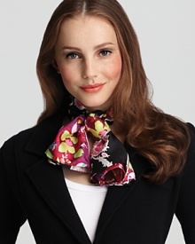 A colorful patchwork of floral patterns create a lovely and stylish silk scarf from Charlotte Sparre.