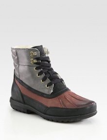 Waterproof ankle boot with shearling lining and Nike Air Technology, for superior comfort and support.Leather liningPadded insoleRubber soleImported Waterproof ankle boot with shearling lining and Nike Air Technology, for superior comfort and support.Leather liningPadded insoleRubber soleImported