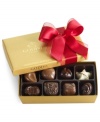 Donned with a soft red bow, this classic collection of Godiva chocolates makes a perfectly sweet and irresistible gift this season in its shimmering gold box.