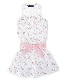 Absolutely charming dress in soft floral cotton jersey with a crocheted racerback silhouette and a pretty sash. Absolutely charming dress in soft floral cotton jersey with a crocheted racerback silhouette and a pretty sash.