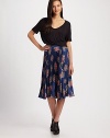 A lady-like print highlights this willowy midi-length silhouette of pleated silk crepe.High waistbandSide zipperAbout 29 long95% silk/5% spandexDry cleanMade in USA of imported fabric