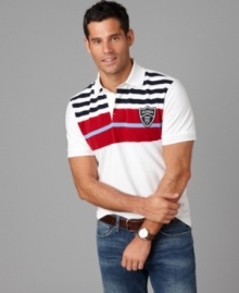 Featuring a crisp color palette and classic stripes, this Tommy Hilfiger polo shirt will be your new weekend go-to. Featuring a crisp color palette and classic stripes, this Tommy Hilfiger polo shirt will be your new weekend go-to.