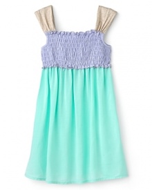 She'll love the flow and flounce of this cute ruffled dress, adorned with contrast smocking at the chest and contrast ruffle shoulder straps. She'll love the flow and flounce of this cute ruffled dress, adorned with contrast smocking at the chest and contrast ruffle shoulder straps.