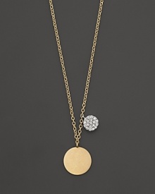 This gold medallion necklace is paired with a mini diamond pavé medallion. Designed by Meira T. This gold medallion necklace is paired with a mini diamond pavé medallion. Designed by Meira T.