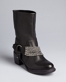 Designer Vera Wang is a personal fan of moto booties; her Vera Wang Lavender Label style is all dressed up with distinctive, draped sparkling details. Designer Vera Wang is a personal fan of moto booties; her Vera Wang Lavender Label style is all dressed up with distinctive, draped sparkling details.