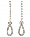 Effortless elegance. Betsey Johnson's linear teardrop earrings sparkle with an array of clear crystals. Set in silver tone mixed metal, they'll dazzle dramatically each time you wear them. Approximate drop: 2-1/4 inches.