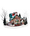 A wonderland of holiday whimsy. Complete with an elfin railroad, snowman, reindeer and decorations galore, Santa's Snow Village abode abounds with all the childhood joys of the season. From Department 56.